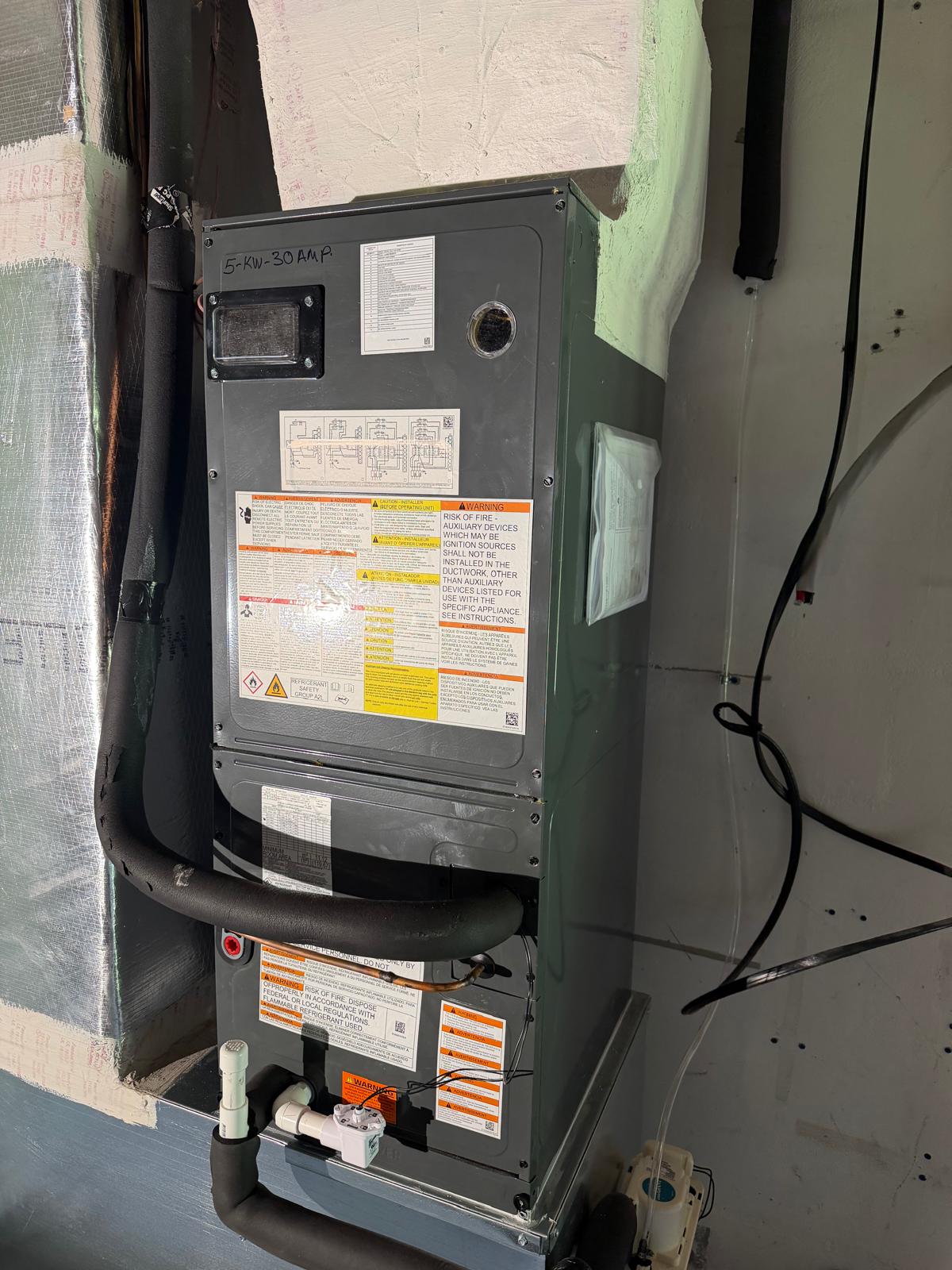 Air handler with 5 KW electric heat installed in a closet